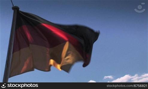 Deutschlandflagge weht im Wind mit blauem Himmel im Hintergrund