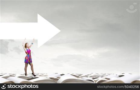 Develop your imagination. Woman in multicolored dress with arrow banner in hands