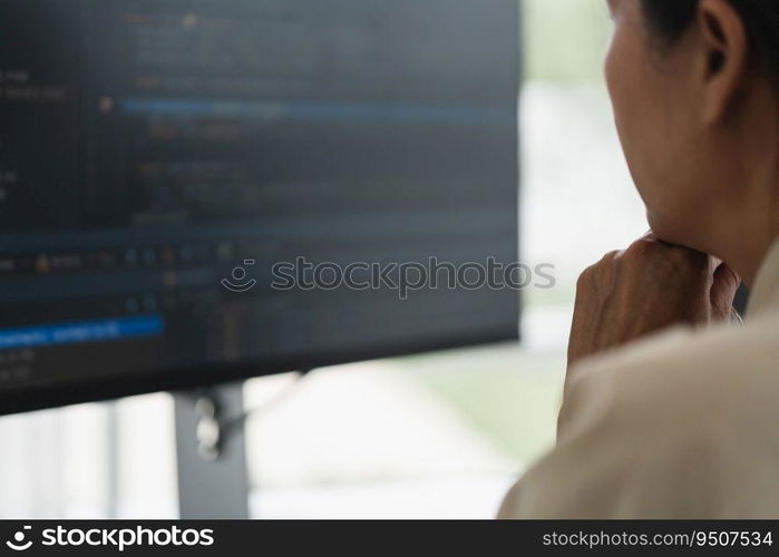 Developer programmer checking code on monitor while programming to developing web and application.