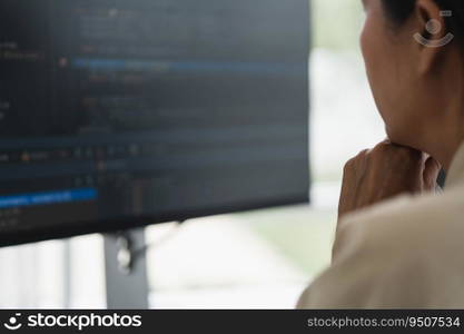 Developer programmer checking code on monitor while programming to developing web and application.
