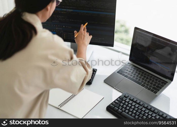 Developer programmer checking code on monitor while programming to developing web and application.