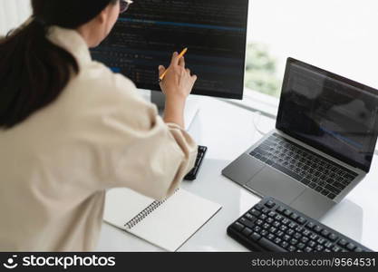 Developer programmer checking code on monitor while programming to developing web and application.