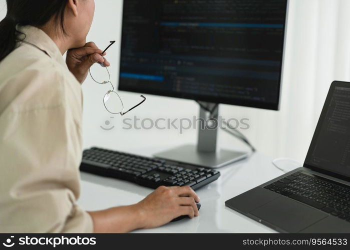 Developer programmer checking code on monitor while programming to developing web and application.