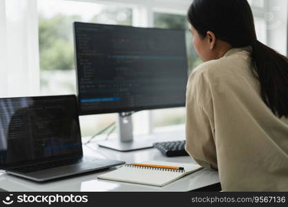 Developer programmer checking code on monitor while programming to developing web and application.