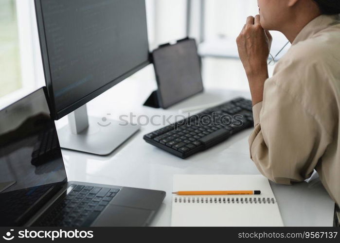 Developer programmer checking code on monitor while programming to developing web and application.