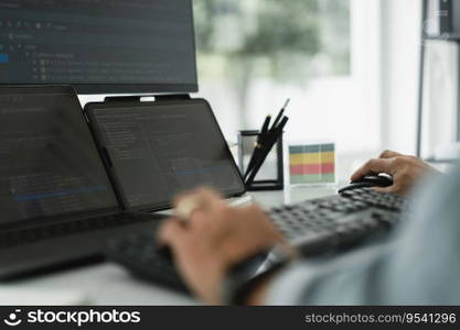 Developer programmer checking code on multiple monitor while programming to developing web and apps.