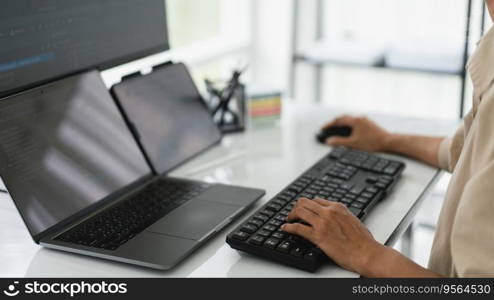 Developer programmer checking code on multiple monitor while programming to developing web and apps.