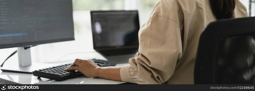 Developer programmer programming code to developing website and application in software office.