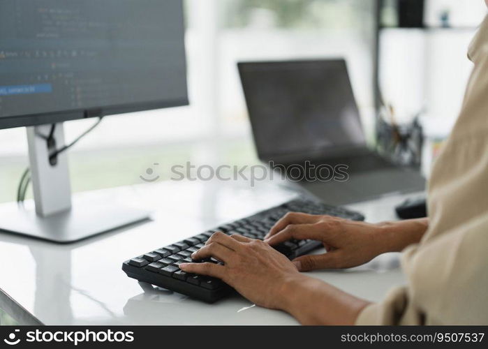 Developer programmer programming code to developing website and application in software office.