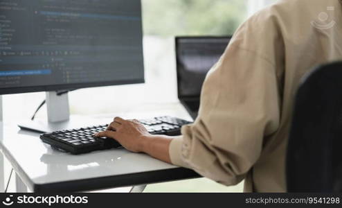 Developer programmer programming code to developing website and application in software office.