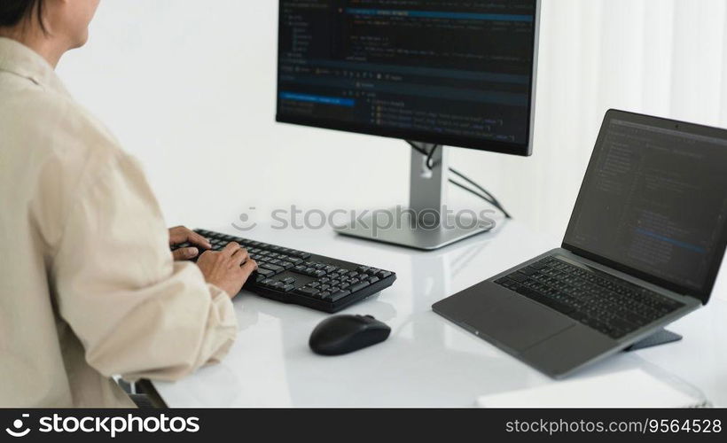 Developer programmer programming code to developing website and application in software office.