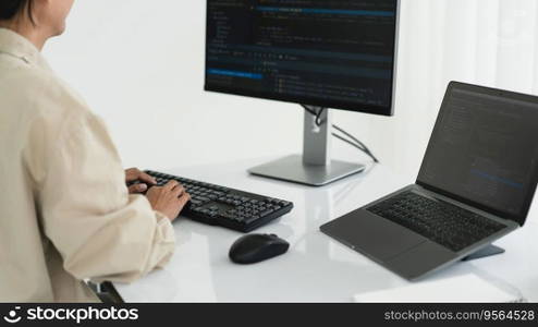 Developer programmer programming code to developing website and application in software office.