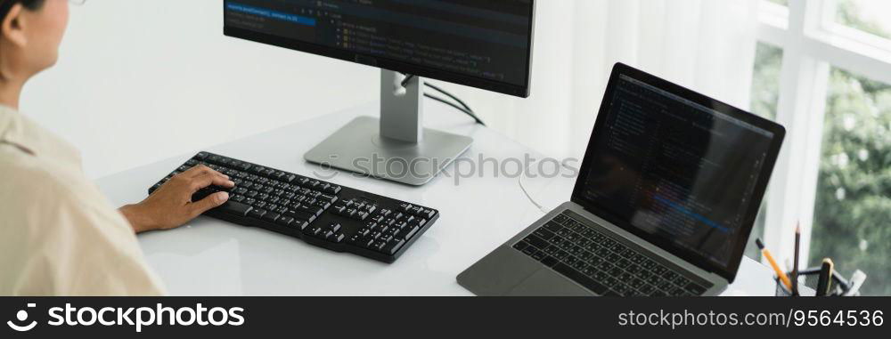 Developer programmer programming code to developing website and application in software office.