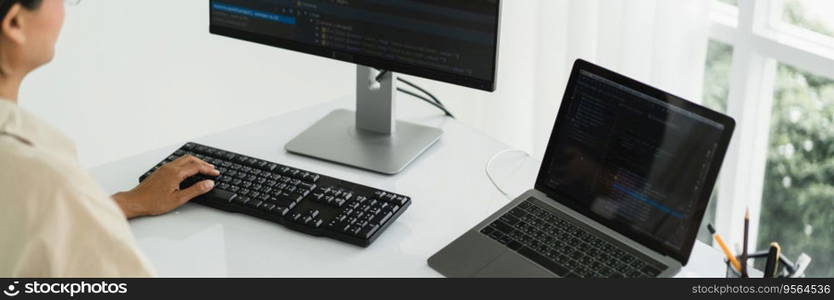 Developer programmer programming code to developing website and application in software office.