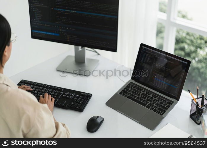 Developer programmer programming code to developing website and application in software office.