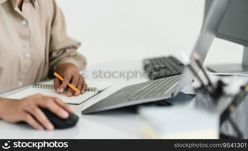 Developer programmer use mouse and checking code on laptop while programming to developing website.