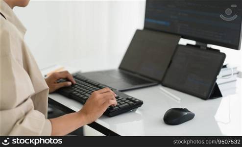 Developer programmer working about programming code to developing web and apps on multiple monitor.