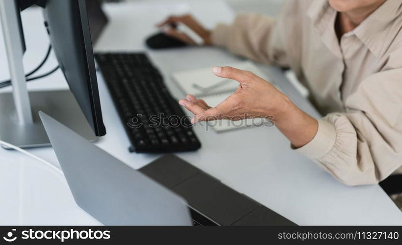 Developer programmer working to checking code on monitor while programming to developing website.
