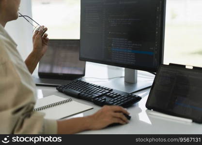 Developer programmer working to checking code on monitor while programming to developing website.