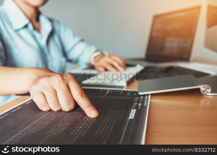 Developing Concentrated programmer reading computer codes Development Website design and coding technologies.