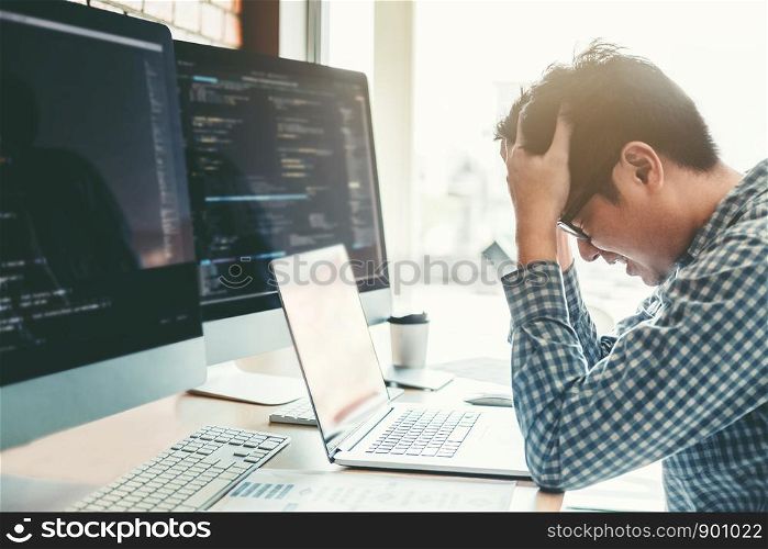 Developing programmer stressed out of work. Development Website design and coding technologies working in software company office