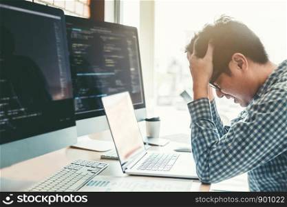 Developing programmer stressed out of work. Development Website design and coding technologies working in software company office