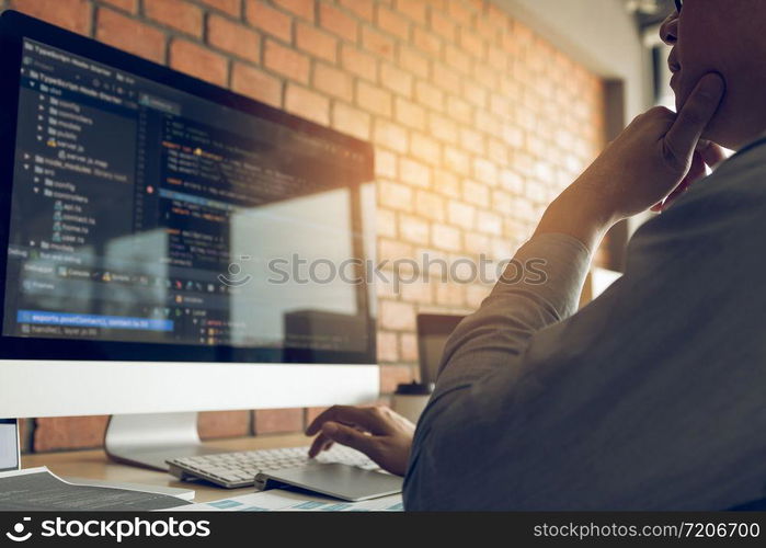 Developing programming and coding technology working in a software develop company office.