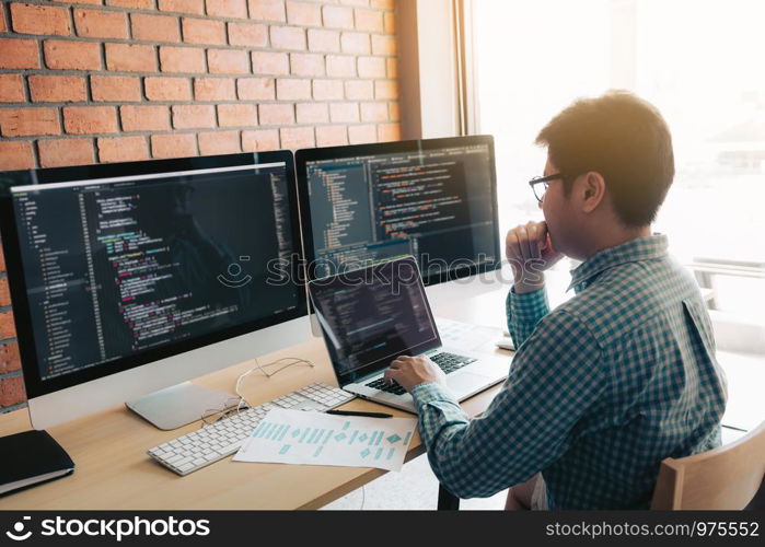 Developing programming and coding technology working in a software develop company office.