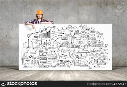 Development project. Young woman builder wearing helmet and holding banner with business sketches