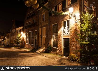 Deventer at night in a Dickens street before Christmas