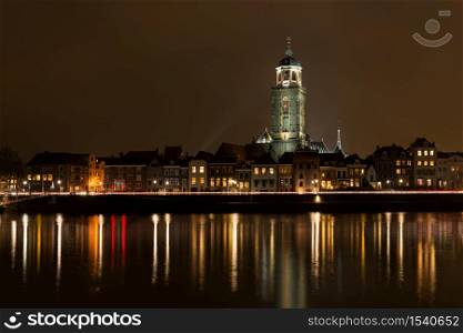 Deventer at night view from the other side of the Ijssel with the Lebuinuschurch