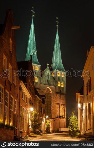 Deventer at night with the Bergkerk seen from the Bergkerkplein with Christmas decorations