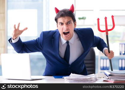 Devil angry businessman in the office