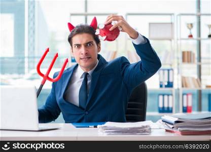 Devil angry businessman in the office