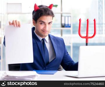 Devil angry businessman in the office. The devil angry businessman in the office