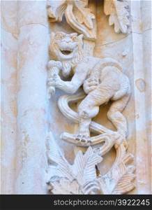 Devil carved on the facade of the cathedral of Salamanca in Spain