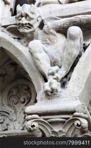 Devil on fasade of The Notre Dame de Paris. France.