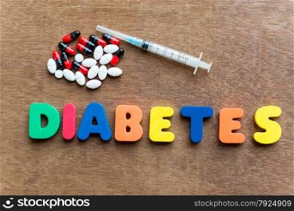 diabetes colorful word in the wooden background