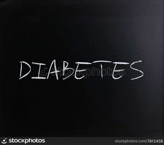 ""Diabetes" handwritten with white chalk on a blackboard."