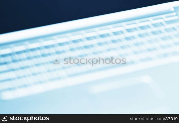 Diagonal cyan laptop keyboard bokeh background. Diagonal cyan laptop keyboard bokeh background
