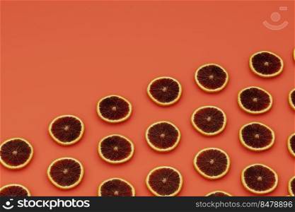 DIagonal placed graipfrut slices on orange background, fruity background concept, 3d rendering
