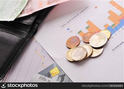 diagramme, credit cards and purse on table