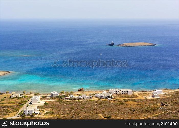 Diakofti port at the Greek island of Kythira. The shipwreck of the Russian boat Norland is in a distance.. Diakofti port at the Greek island of Kythira. The shipwreck of the Russian boat Norland in a distance.