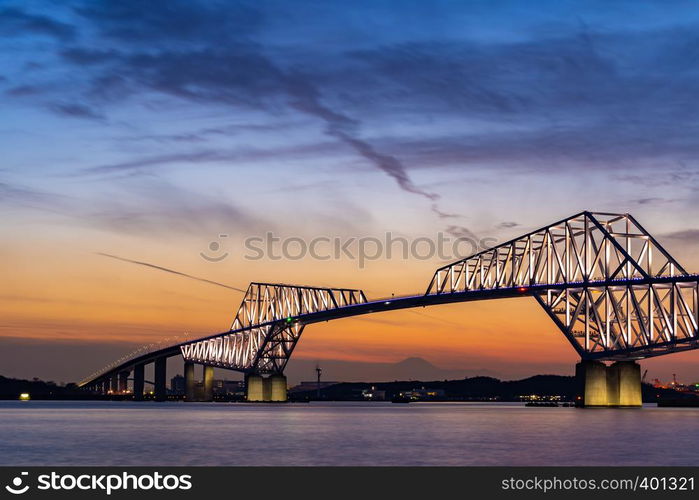 Diamond Fuji in Tokyo with Tokyo Gate Bridge, natural phenomenons that sun move pass mountain Fuji while sunset in Tokyo Japan. This happen only 2 times once a year.