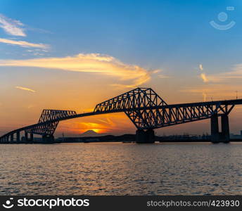 Diamond Fuji in Tokyo with Tokyo Gate Bridge, natural phenomenons that sun move pass mountain Fuji while sunset in Tokyo Japan. This happen only 2 times once a year.