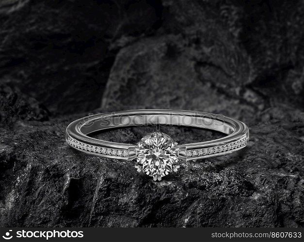 Diamond ring on black coal background