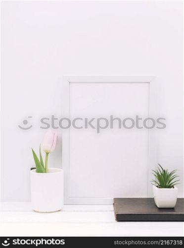 diary plant tulip flower with blank frame white table