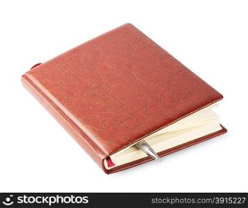 Diary with a brown leather cover and pen isolated on white background