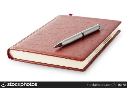 Diary with a pen lying on it isolated on a white background. Diary with a pen lying on it