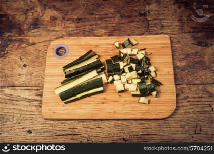 Diced and chopped courgette on a chopping board